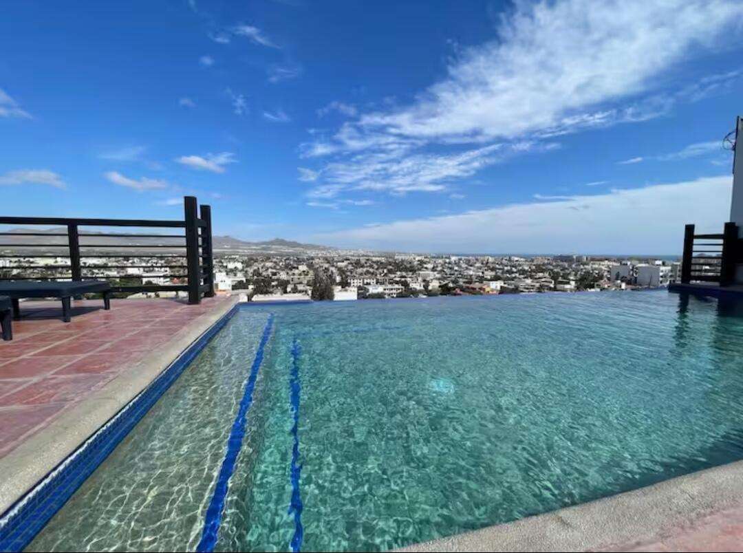 Los Cabos Morgan Residences Your perfect condo in Cabo! Excellent Airbnb rental or your very own centrally located to downtown and the Marina home. Fully furnished 2 bedroom, 2 bath spacious unit with a lock off option! Making it perfect to live and enjoy rental income, or have two rentals at once, with complete privacy. Exclusive entrance, gated community, covered parking, equipped gym, sunny rooftop terrace with pool, amazing for sale