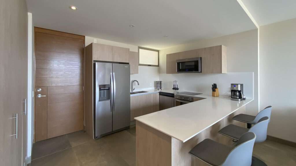 Los Cabos Ladera Phase 1 LADERA, a private community located in the highly desirable Golden Zone of San José del Cabo, an area known for its strong appreciation and excellent quality of life.This first-level condo offers a contemporary and highly functional design created by the renowned architectural firm Landa Arquitectos. The residence features two bedrooms and two full bathrooms with a well-planned layout that maximizes comfort and usability.The condo includes stainless steel appliances, a laundry center, inverter air conditioning units in every room, and blinds on all windows. Additional features include two designated underground parking spaces, elevator access, and a beautiful ocean – LADERA Condo, San Jose Corridor, San Jose Corridor, BS