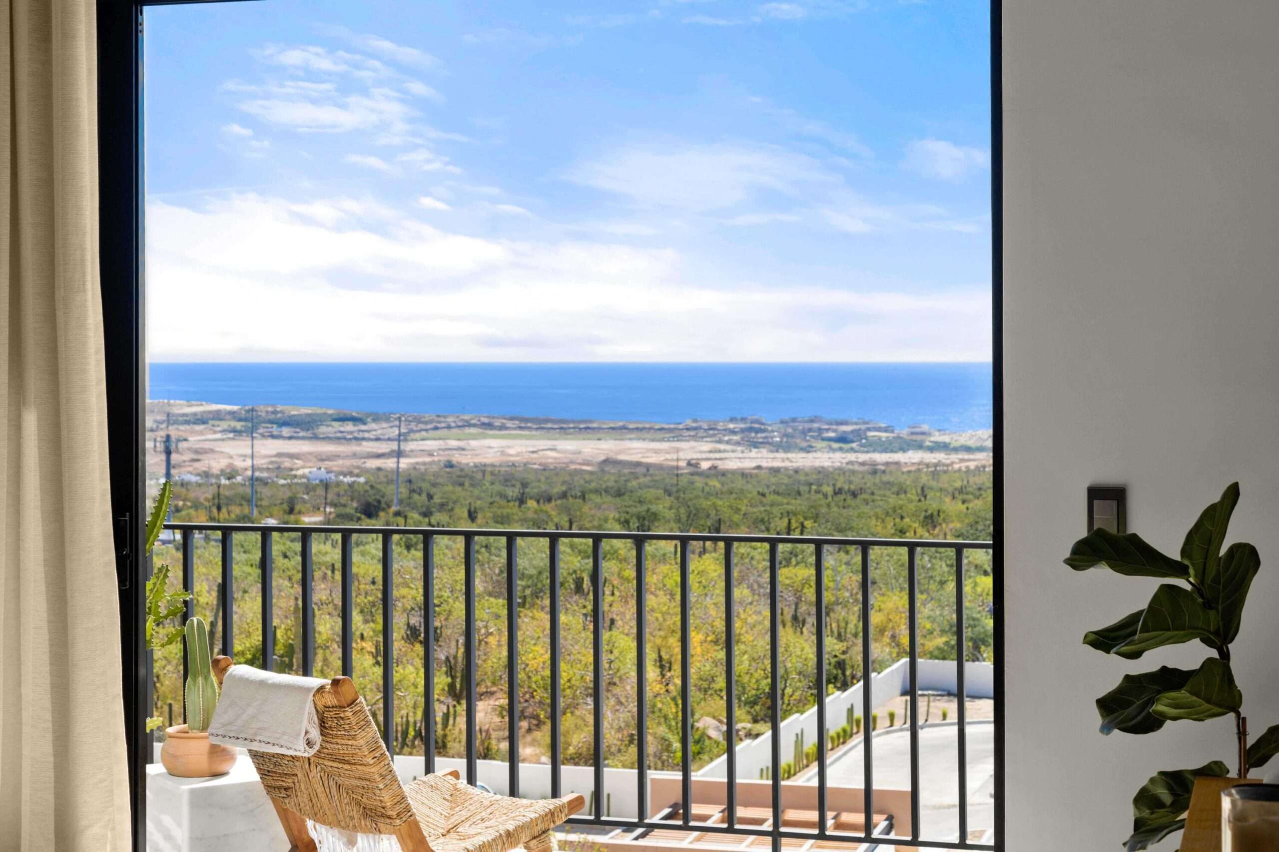 Los Cabos Morgan Residences Morgan Residences Condo 306 offers 67 m² of functional living space with one bedroom, one and a half baths, and a private balcony overlooking the city. The open floor plan connects the kitchen, dining, and living areas with marble-style tile throughout. The kitchen has granite counters, white cabinets, and an island with seating. The bedroom includes an ensuite bathroom with a walk-in shower and opens to the terrace. A separate half bath includes in-unit laundry. The building features a rooftop pool, gym, BBQ area, and for sale