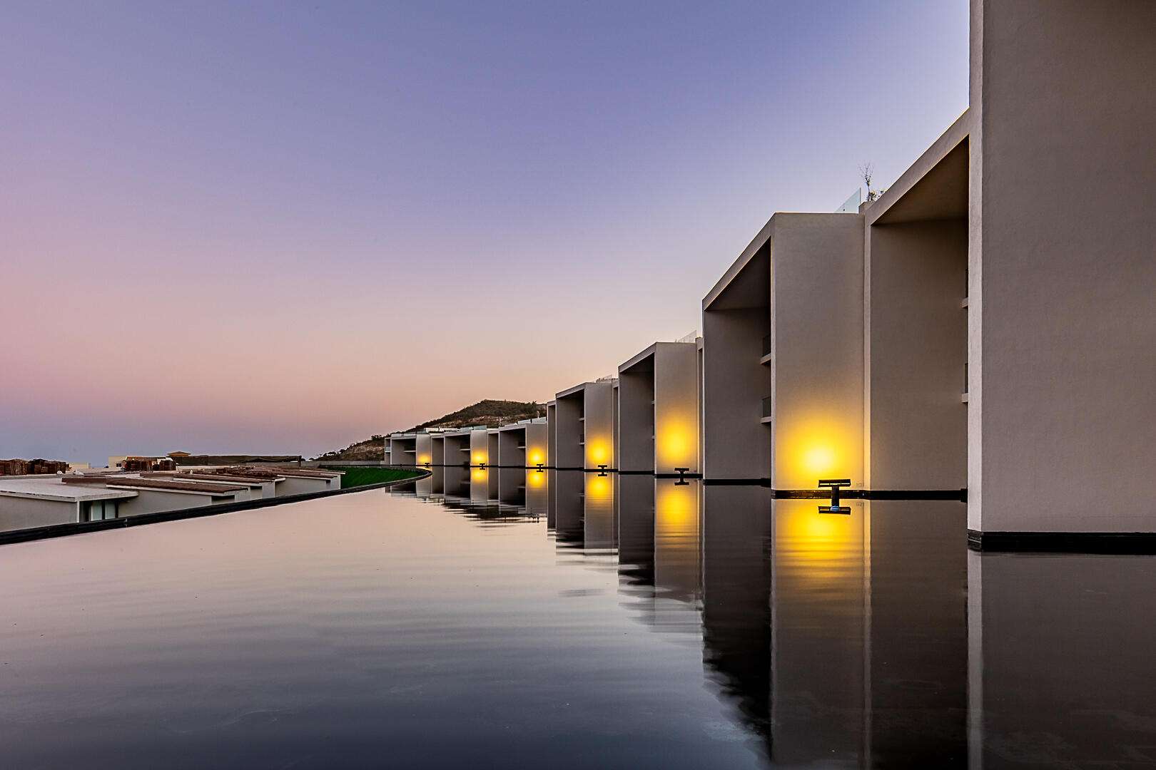 Los Cabos Cora SUNSET A 101- the crown jewel of the entire development. A rare 6-bedroom, 5.2-bath residence spanning two full living levels: the main floor plus a private underground bunker suite with its own living room, dining room, kitchen, bedrooms and baths -- ideal for multigenerational living or an income-producing guest retreat. Enjoy a private pool, jacuzzi, fire pit and BBQ area under an extended pergola, plus an extended terrace beside a tranquil espejo de agua. Ocean – EL TEZAL, Cabo Corridor, BS