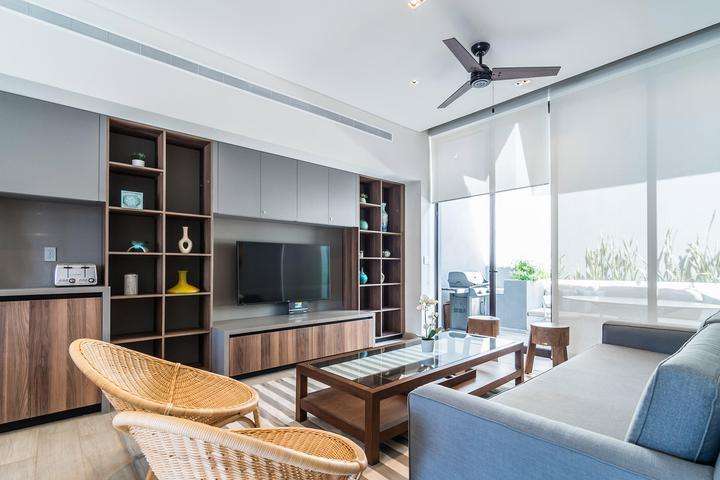 Los Cabos The Paraiso Residences Beautiful Condo located in The Paraiso Residences, a modern new complex of luxury condominiums located at Puerto Paraiso Mall. In the middle of the Cabo San Lucas Marina, known to host ultra luxury yachts, one of the biggest sport fishing annual competitions ''Bisbee's'', plus plenty of restaurants for early breakfast or fine dining, as well as the top Cabo night spots. This Condo features modern decoration in perfectly illuminated spaces, kitchen fully equipped. A spacious and fun living room perfect to entertain and relax, with a comfortable couch that can make extra sleeping space. Two well sized bedrooms, Master with King size bed and ensuite shower bathroom as well, both with spacious closet space. The living room pocket doors open to extend your social area to the exterior terrace with BBQ and dining for six. Enjoy the roof top private terrace with a wonderful jacuzzi, lounge beds to soak in the sun or admire the Baja skylights – Vista Vela III, Cabo Corridor, BS